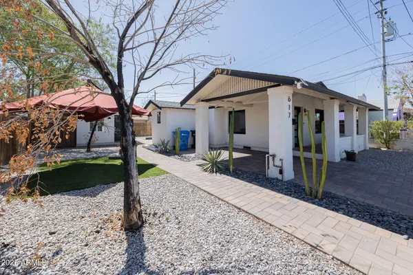 a view of a house with a yard