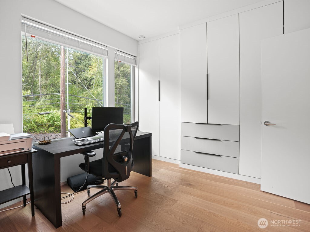 17338 Bothell Way Northeast, Unit E Bothell, WA 98011 - Photo 16 of 26 a view of a workspace with furniture and a window