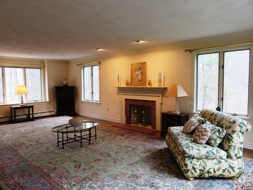 764 Main Street Boxford, MA 01921 - Photo 16 of 28 a living room with furniture and a fireplace