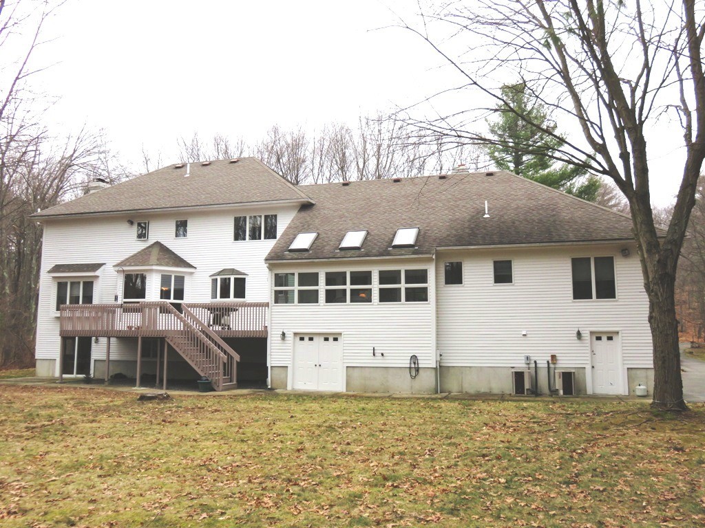 764 Main Street Boxford, MA 01921 - Photo 3 of 28 a front view of a house with a yard