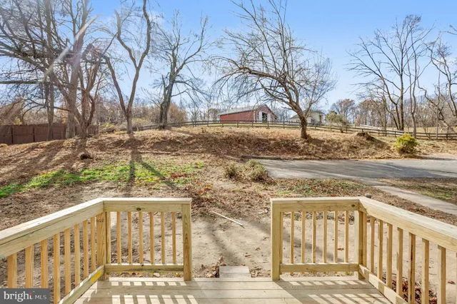a view of a yard with snow on the road