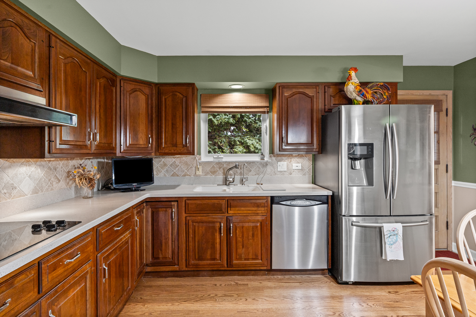 601 North Broadway Avenue Park Ridge, IL 60068 - Photo 9 of 24 a kitchen with stainless steel appliances granite countertop a refrigerator a sink and a stove