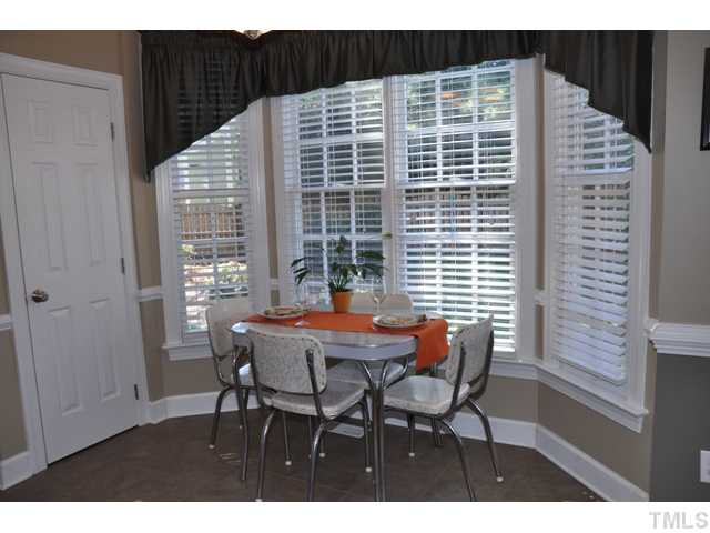 9313 Cub Trail Raleigh, NC 27615 - Photo 6 of 23 Eat-in-kitchen features breakfast nook/bay window--overlooks deck and back yard. Seller has made changes since photo was taken