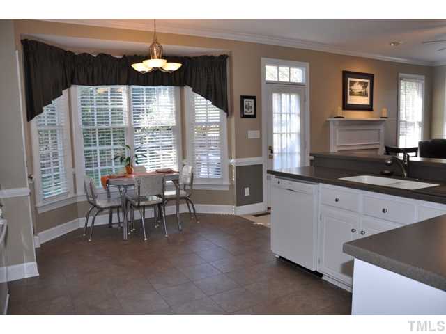 9313 Cub Trail Raleigh, NC 27615 - Photo 7 of 23 Kitchen opens to family room and deck