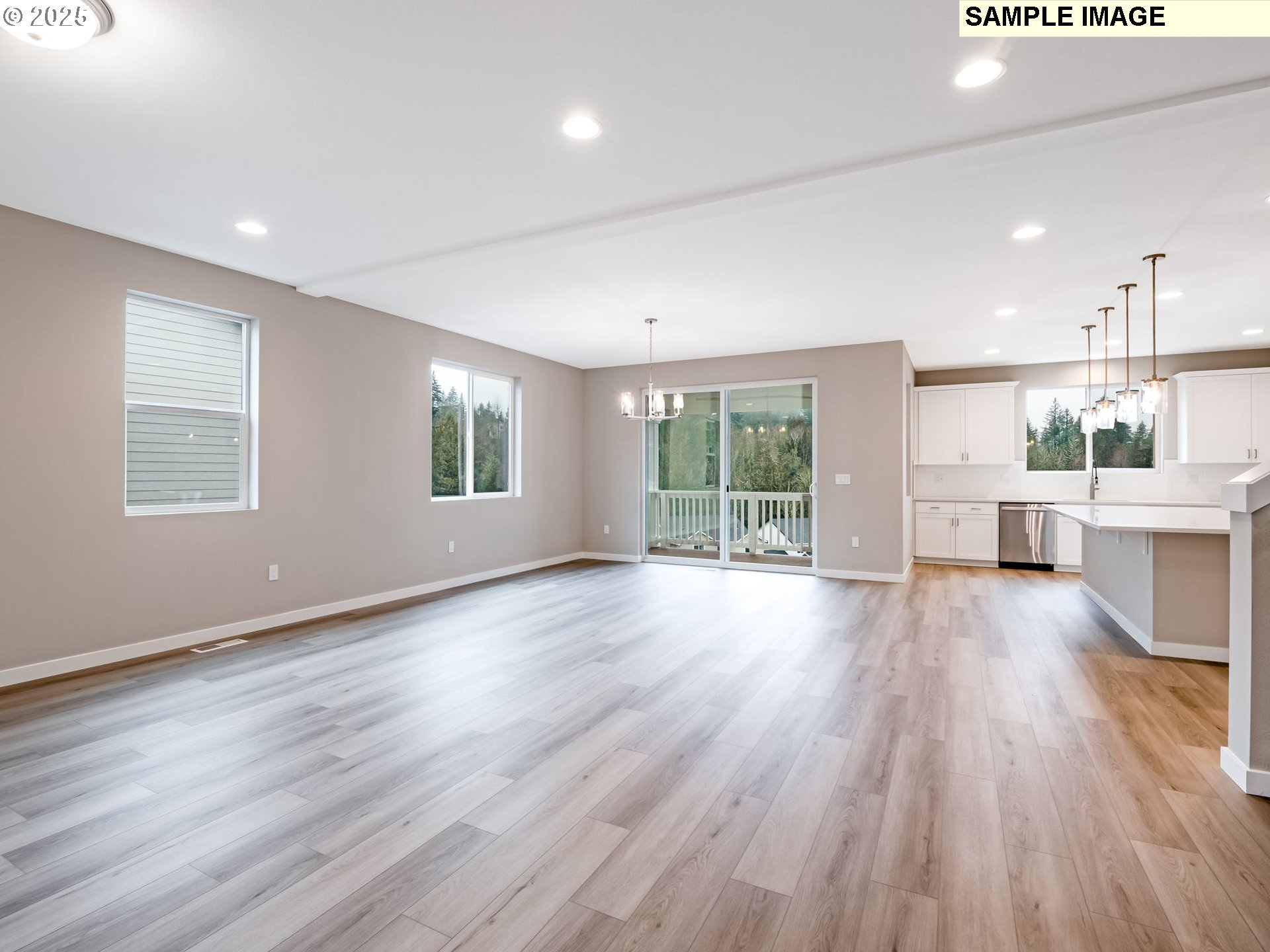 2151 Northeast Ridge Run Lane Estacada, OR 97023 - Photo 2 of 46 an empty room with wooden floor and windows