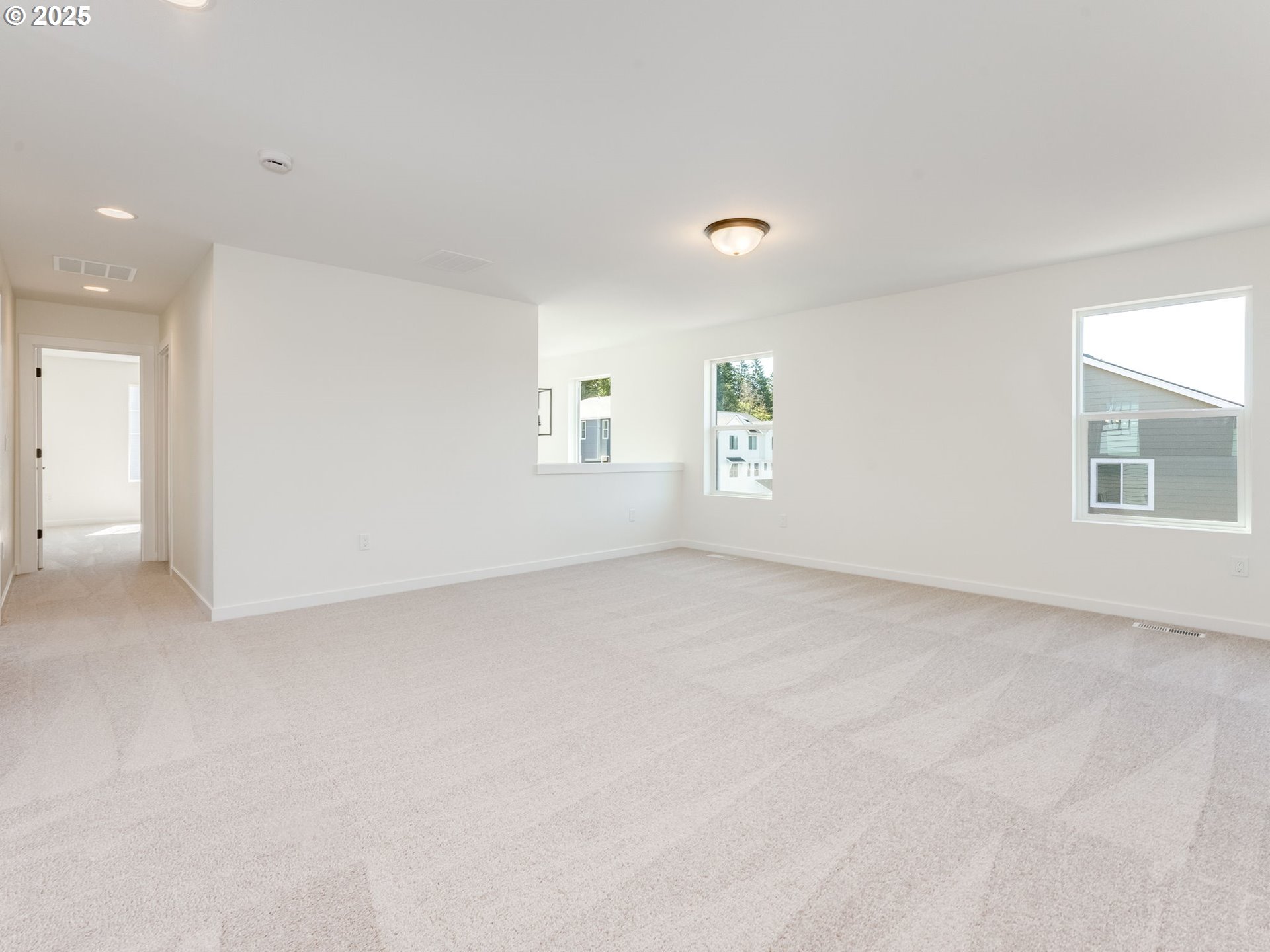 2151 Northeast Ridge Run Lane Estacada, OR 97023 - Photo 23 of 46 an empty room with windows