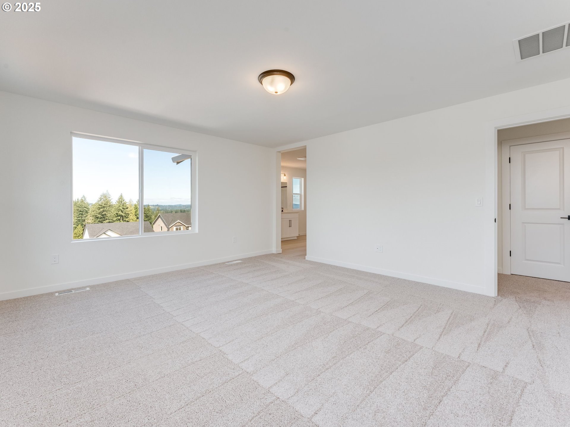 2151 Northeast Ridge Run Lane Estacada, OR 97023 - Photo 25 of 46 a view of an empty room with a window