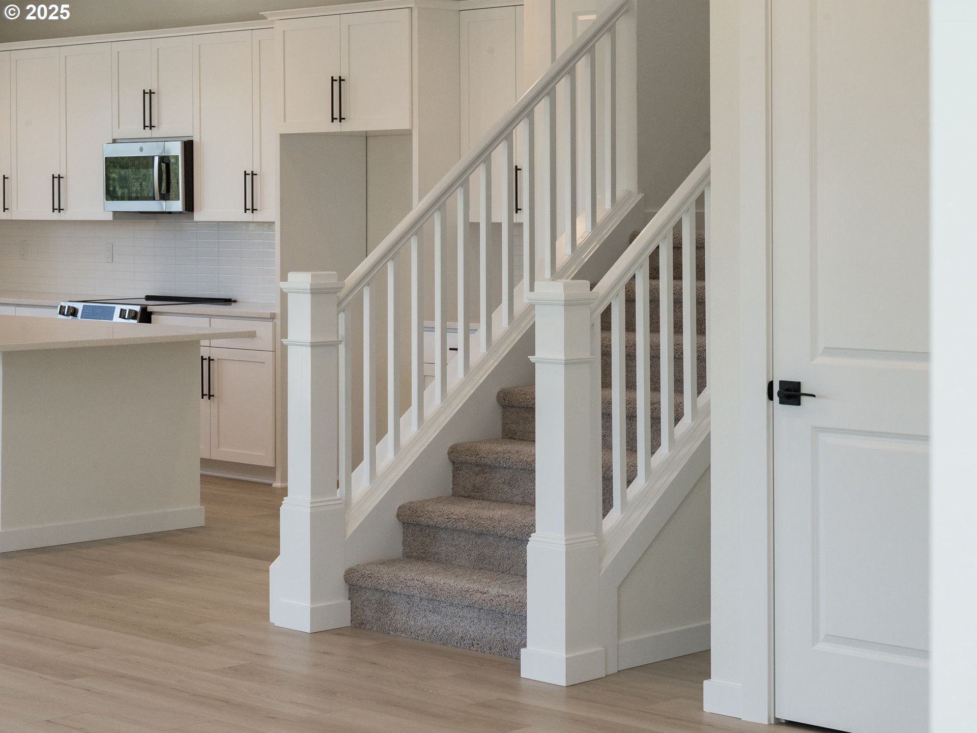 2151 Northeast Ridge Run Lane Estacada, OR 97023 - Photo 35 of 46 a view of entryway and kitchen with wooden floor