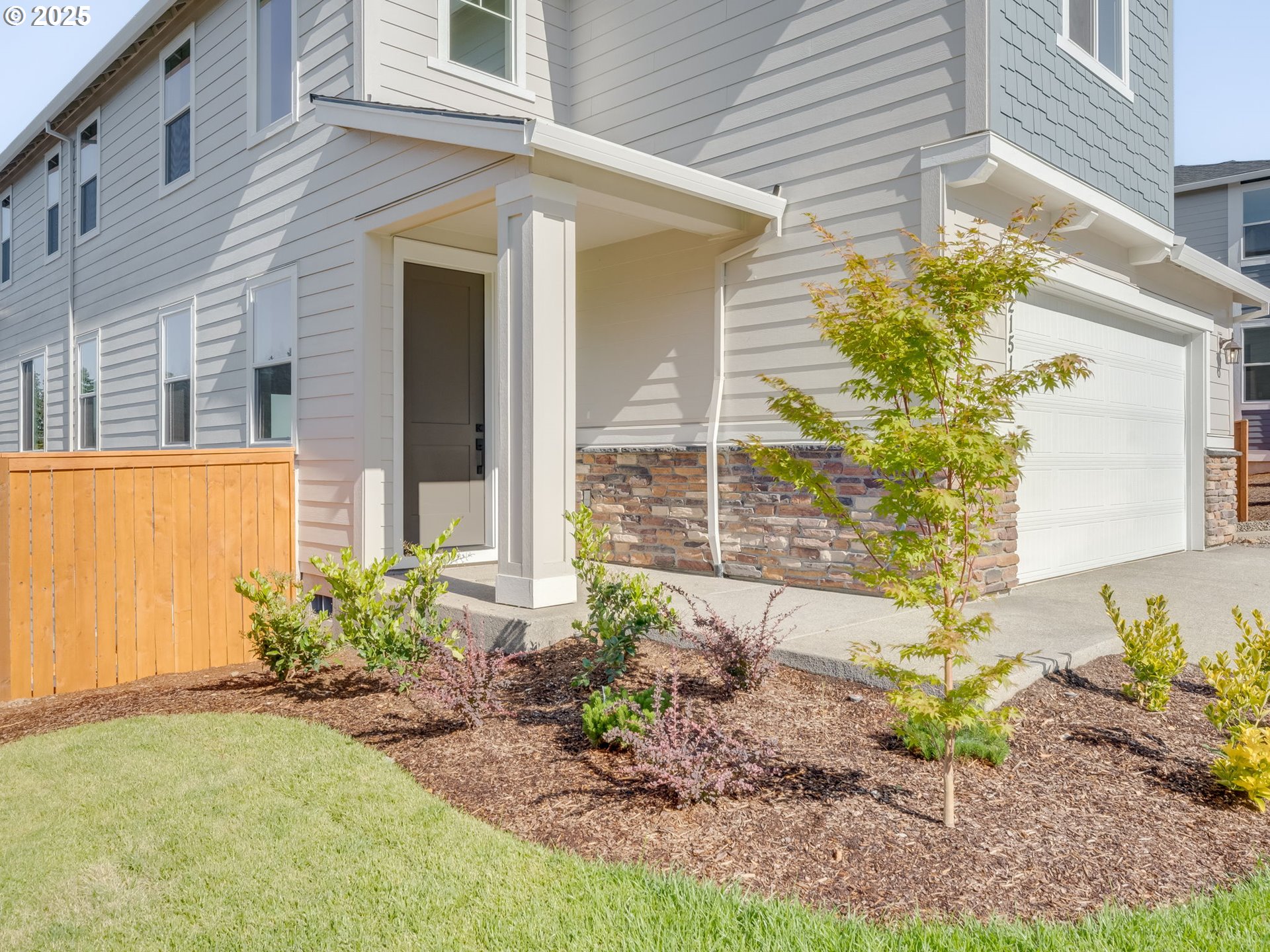 2151 Northeast Ridge Run Lane Estacada, OR 97023 - Photo 42 of 46 a front view of a house with a garden