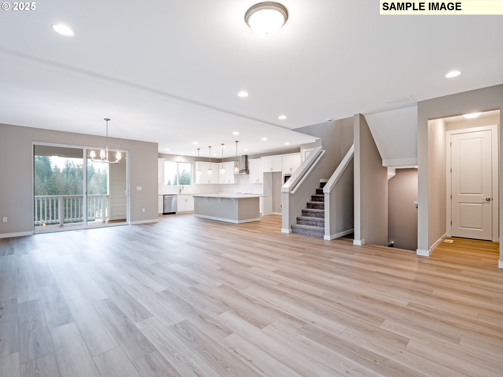 2151 Northeast Ridge Run Lane Estacada, OR 97023 - Photo 6 of 46 a view of empty room with wooden floor and windows