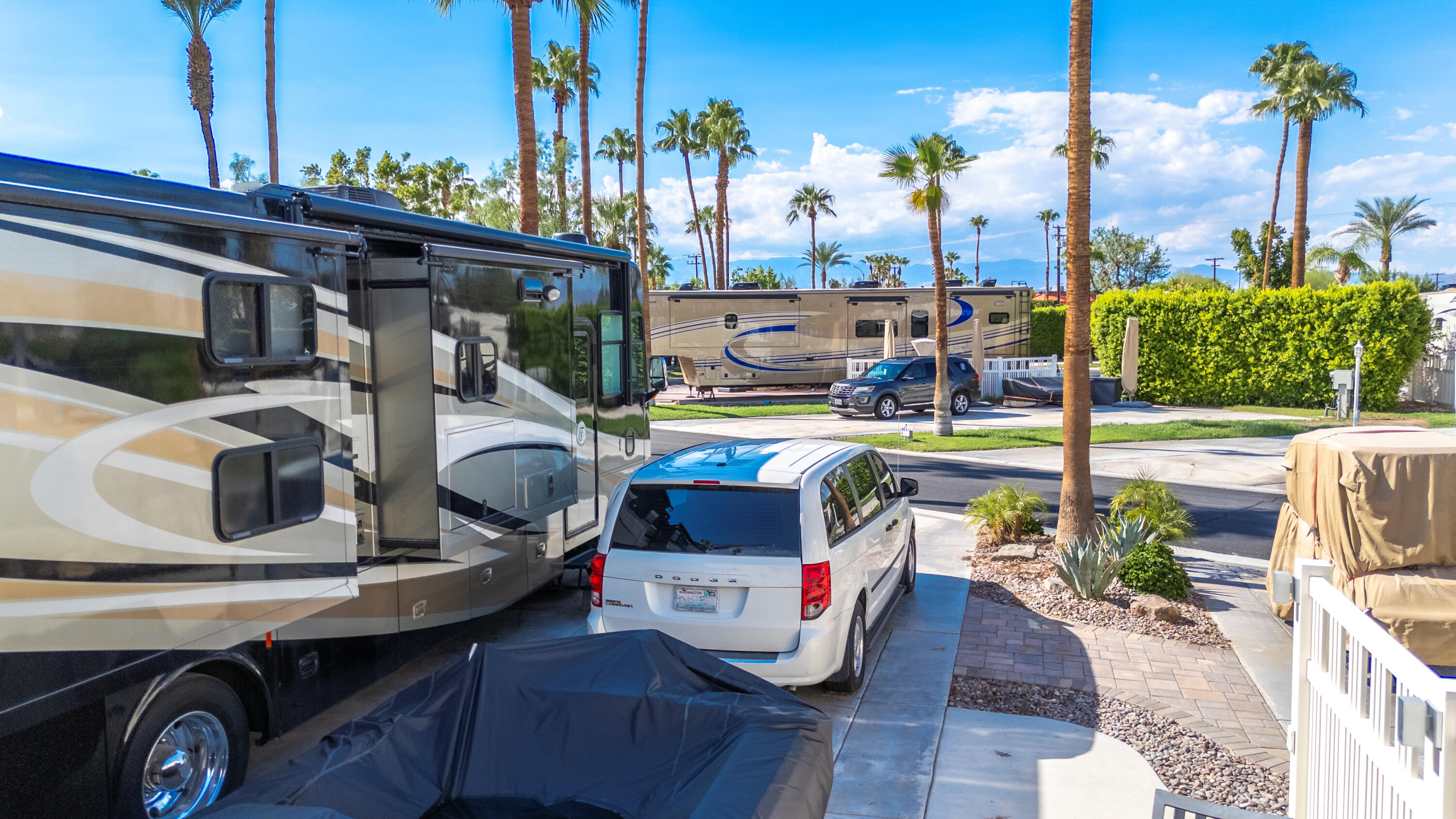 69411 Ramon Road, Unit 69 Cathedral City, CA 92234 - Photo 11 of 48 a view of a patio with table and chairs potted plants