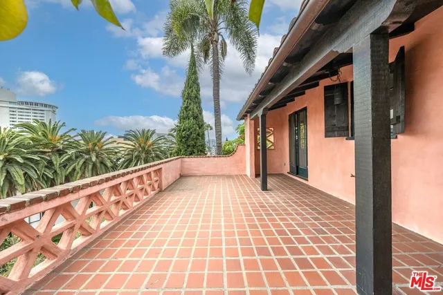 a view of balcony with wooden floor