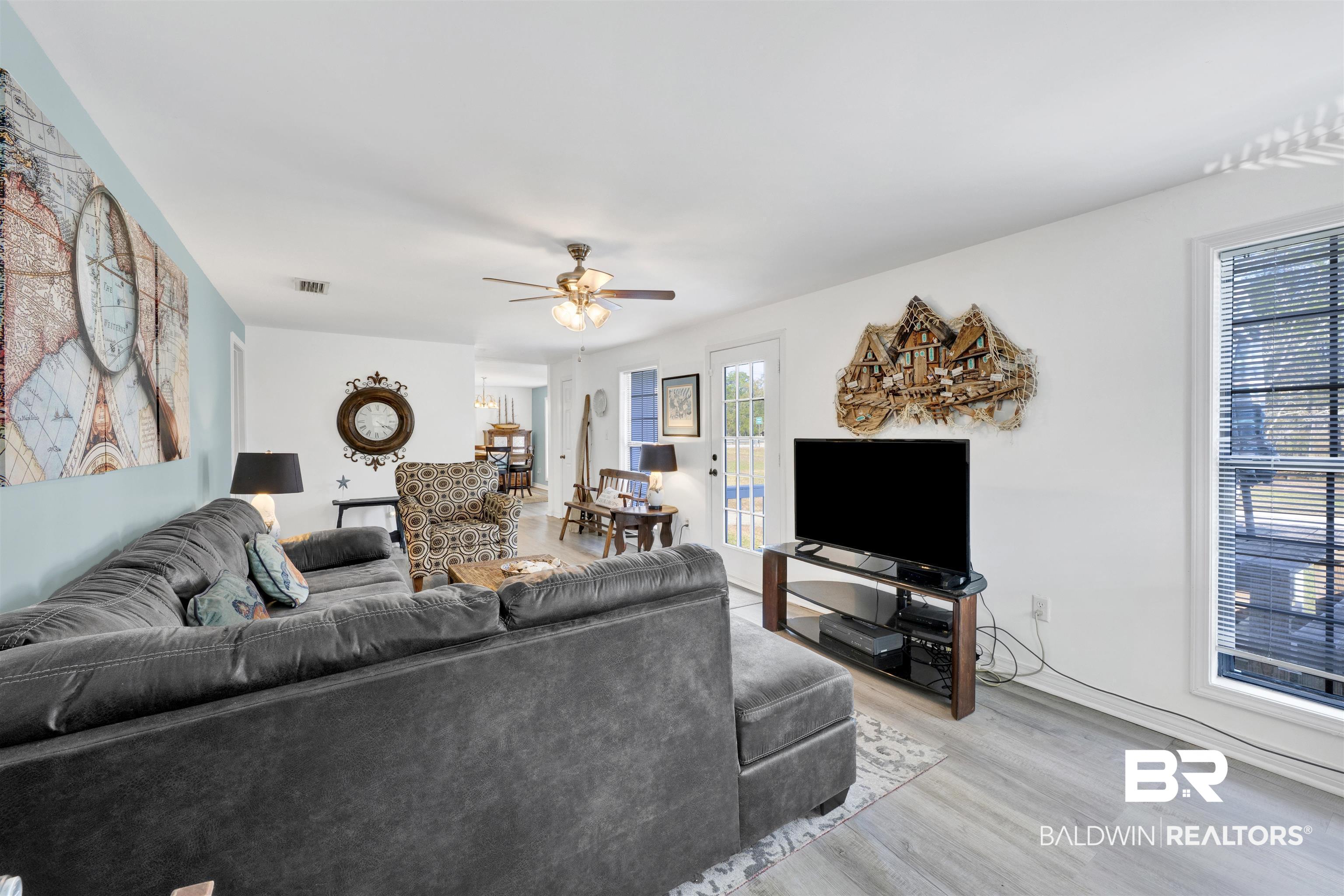 23770 Miflin Road Elberta, AL 36530 - Photo 6 of 38 Living room with a ceiling fan and light wood-type flooring