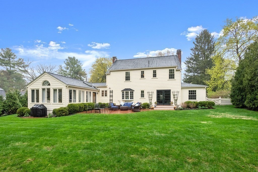 3 Viles Street Weston, MA 02493 - Photo 3 of 25 a front view of a house with a garden and trees