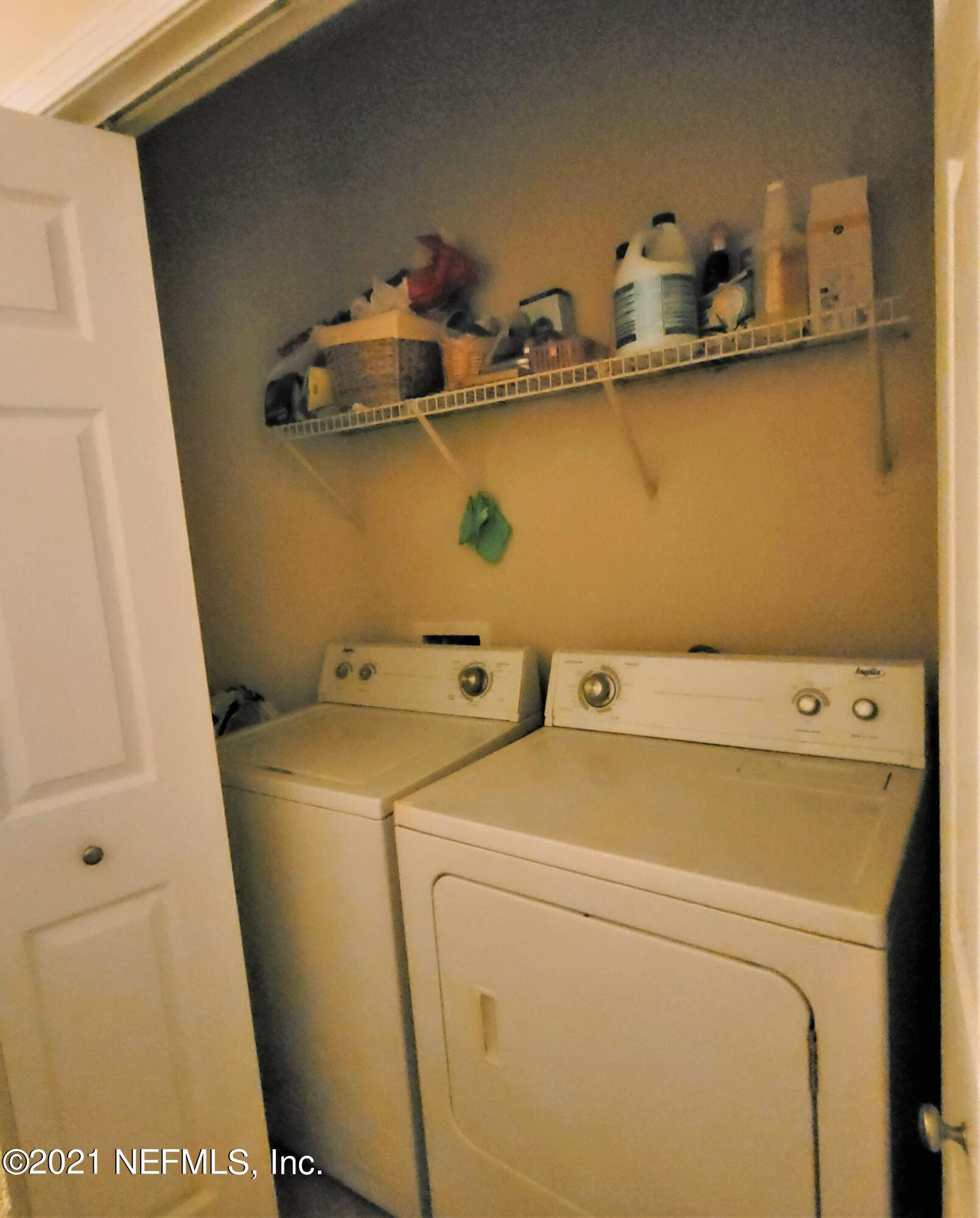 2190 Monument Road, Unit 104 Jacksonville, FL 32225 - Photo 24 of 27 a utility room with dryer and washer