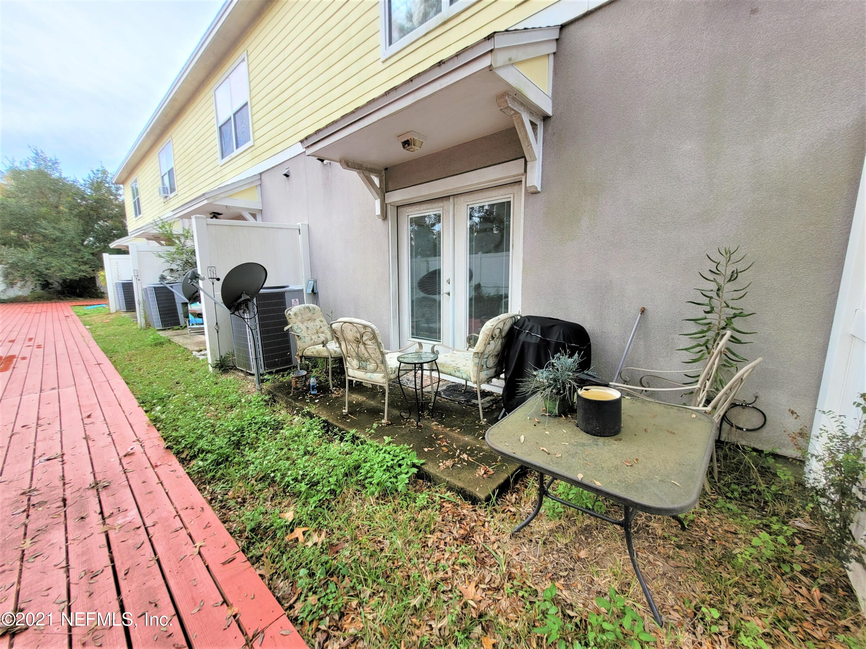 2190 Monument Road, Unit 104 Jacksonville, FL 32225 - Photo 25 of 27 a view of backyard of house with outdoor seating