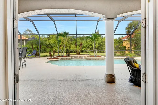a dining room with furniture a chandelier and window