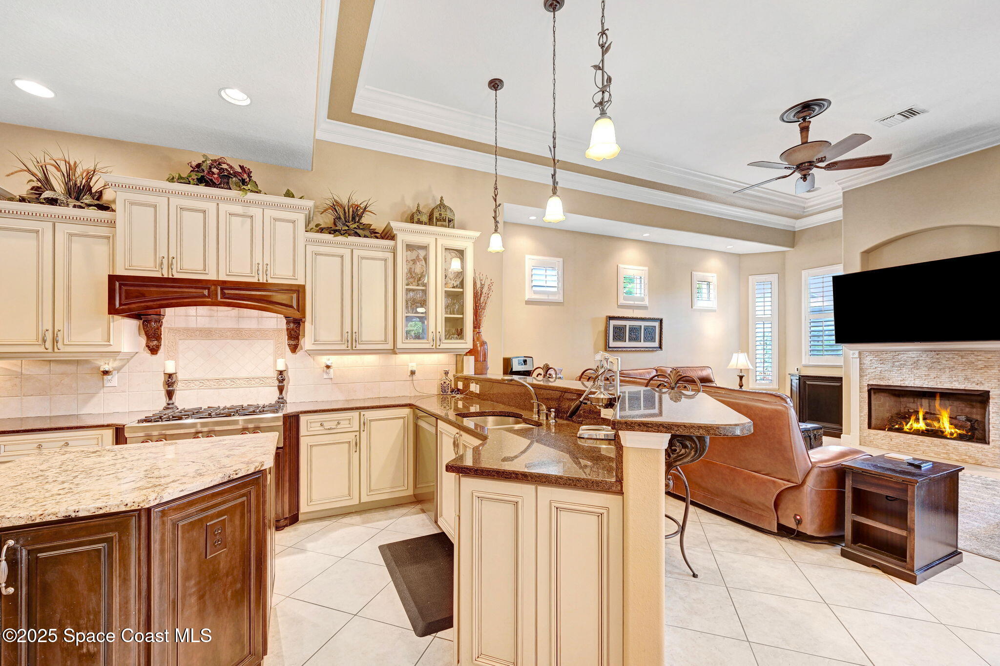 1418 Southpointe Court Melbourne, FL 32940 - Photo 25 of 52 a kitchen with stainless steel appliances granite countertop a sink and cabinets
