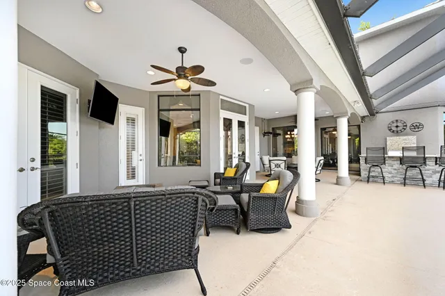 a view of a swimming pool with a patio