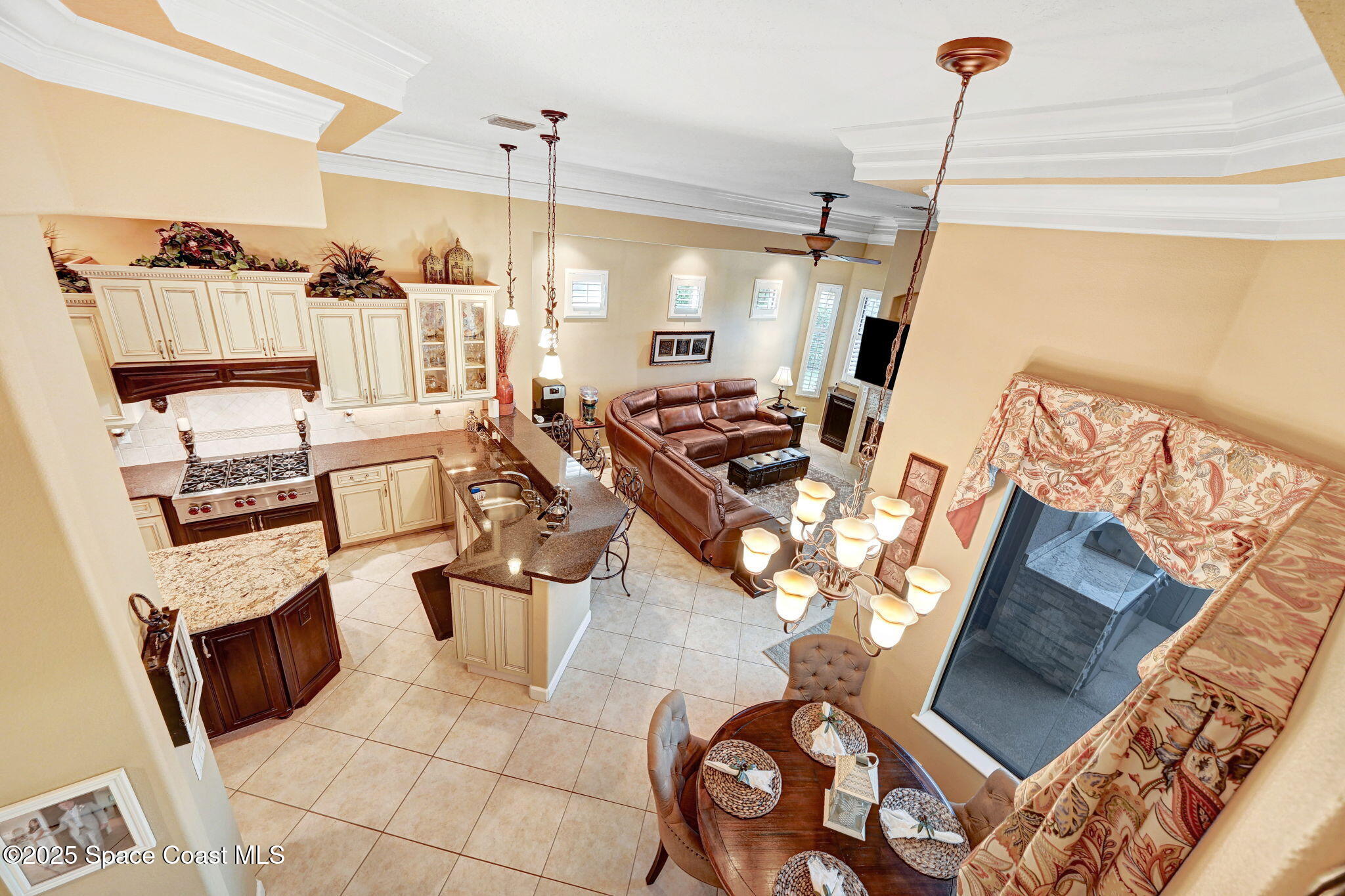 1418 Southpointe Court Melbourne, FL 32940 - Photo 41 of 52 a living room with furniture a flat screen tv and a window