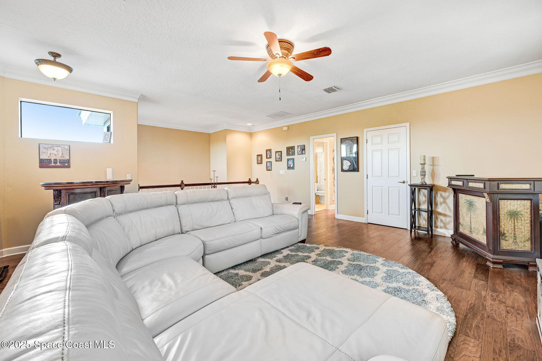 1418 Southpointe Court Melbourne, FL 32940 - Photo 43 of 52 a living room with furniture and a large window