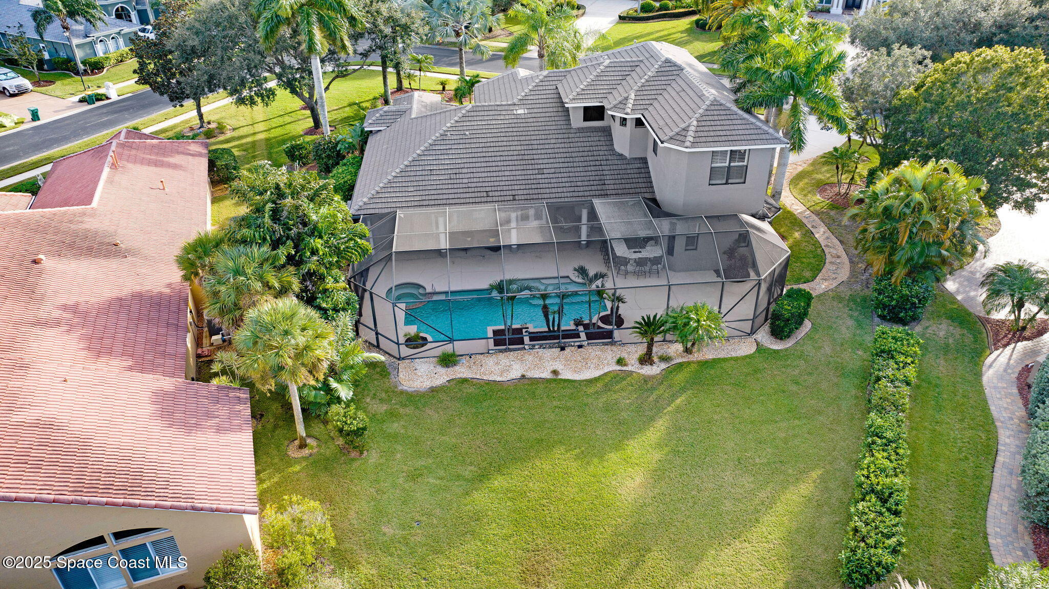 1418 Southpointe Court Melbourne, FL 32940 - Photo 8 of 52 an aerial view of a house with swimming pool garden and patio
