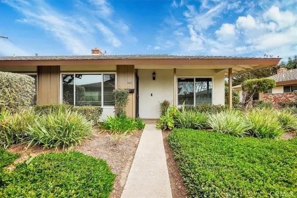 a swimming pool with outdoor seating yard and green space