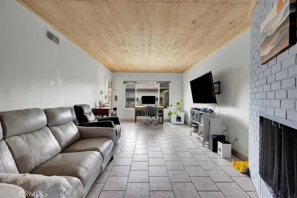 a kitchen with stainless steel appliances a stove microwave and sink