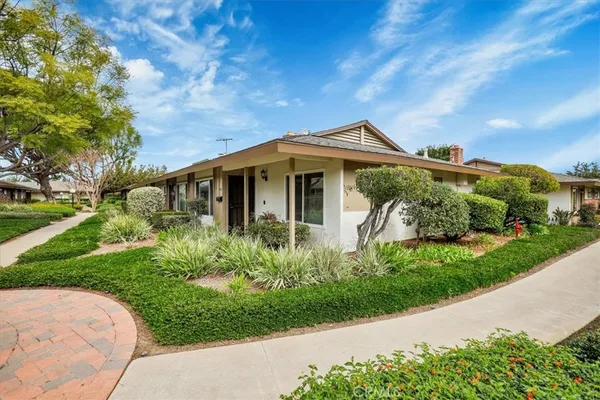 a view of a livingroom with workspace and a flat screen tv