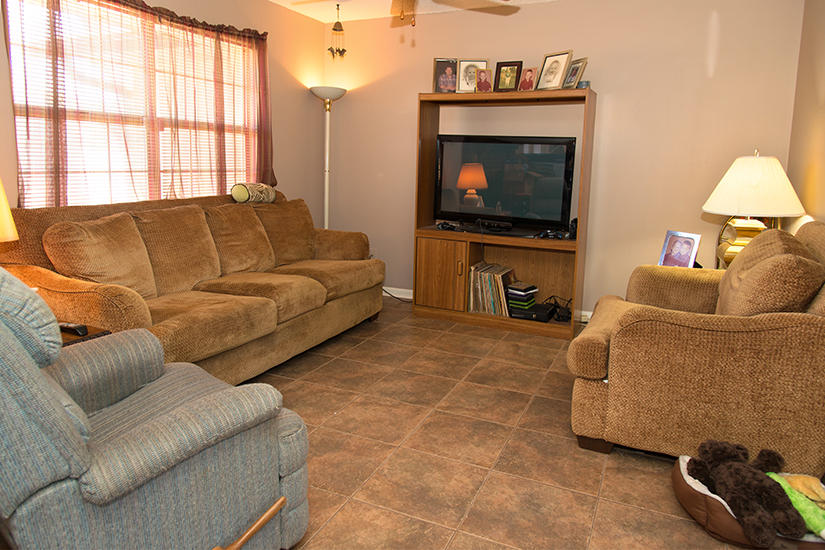 89 11th Avenue Shalimar, FL 32579 - Photo 3 of 9 a living room with furniture and a flat screen tv