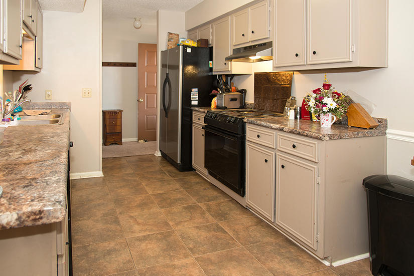 89 11th Avenue Shalimar, FL 32579 - Photo 4 of 9 a kitchen with stainless steel appliances granite countertop a refrigerator and a stove