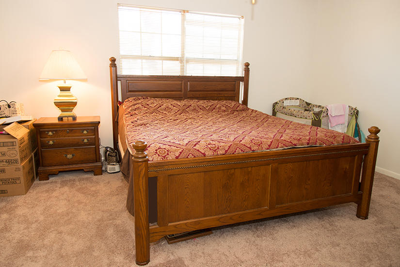 89 11th Avenue Shalimar, FL 32579 - Photo 7 of 9 a bed sitting in a bedroom next to a window