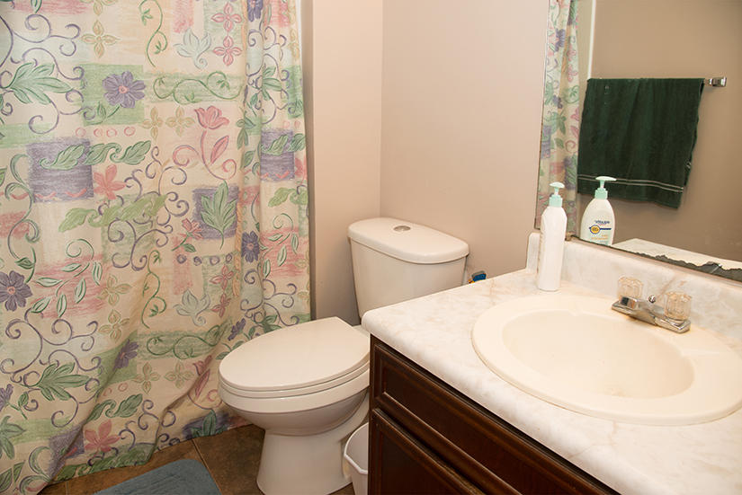 89 11th Avenue Shalimar, FL 32579 - Photo 8 of 9 a bathroom with a sink and a toilet