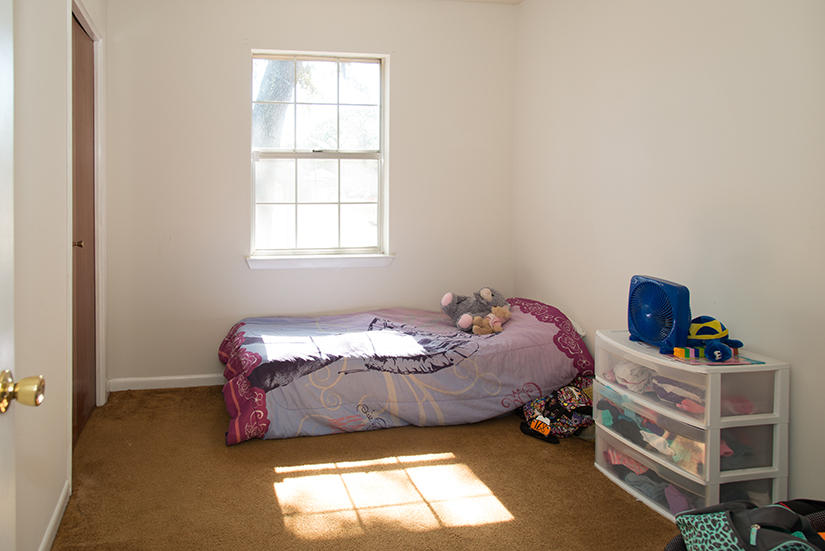 89 11th Avenue Shalimar, FL 32579 - Photo 9 of 9 a bedroom with a bed and a window