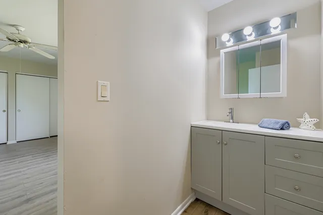 a bathroom with a sink and mirror