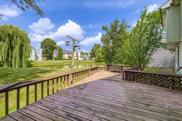 a view of a balcony with wooden floor