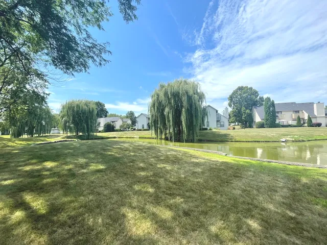 a view of a playground with basketball court
