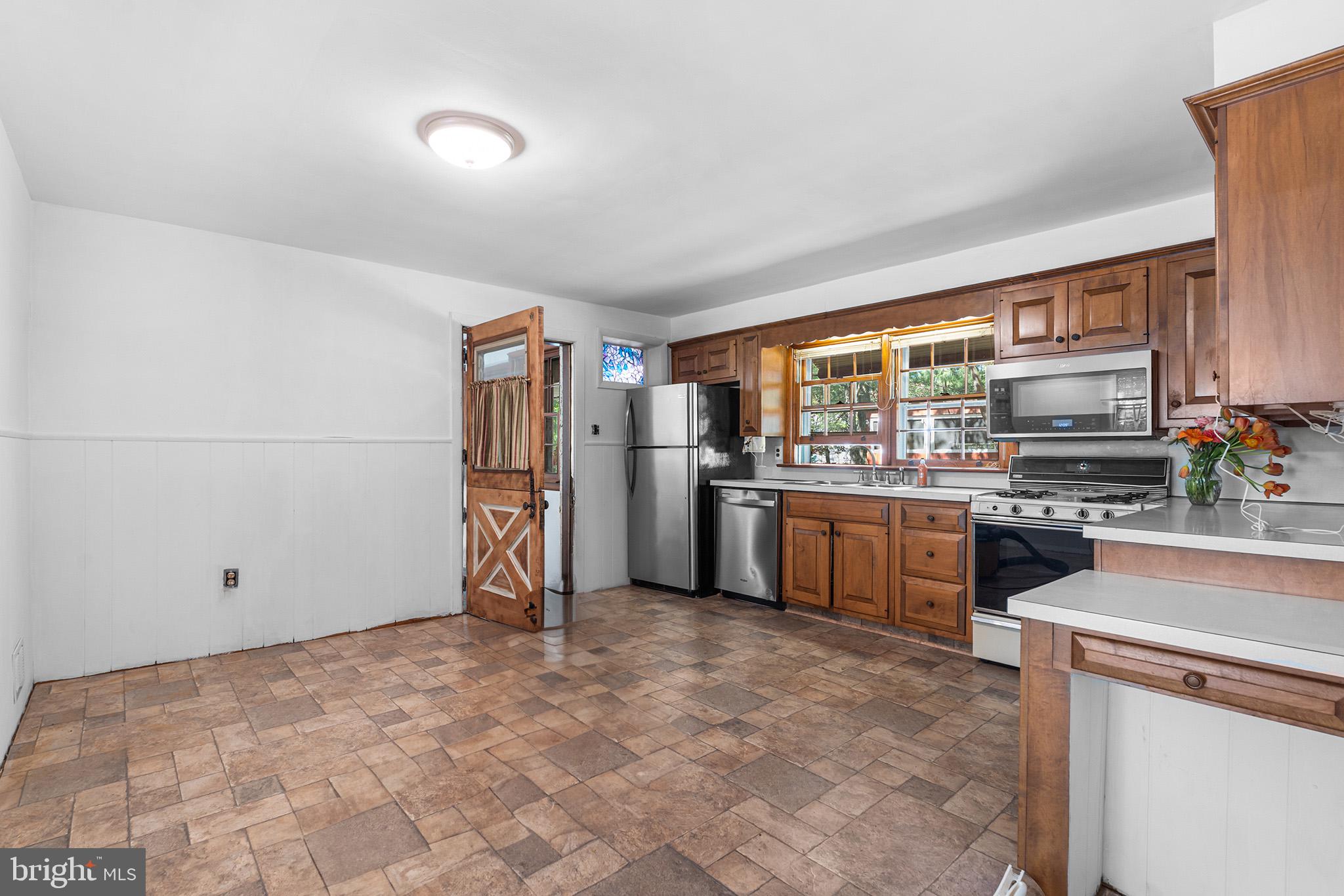 98 Spruce Lane Pine Hill, NJ 08021 - Photo 12 of 28 a kitchen with stainless steel appliances a refrigerator sink and stove