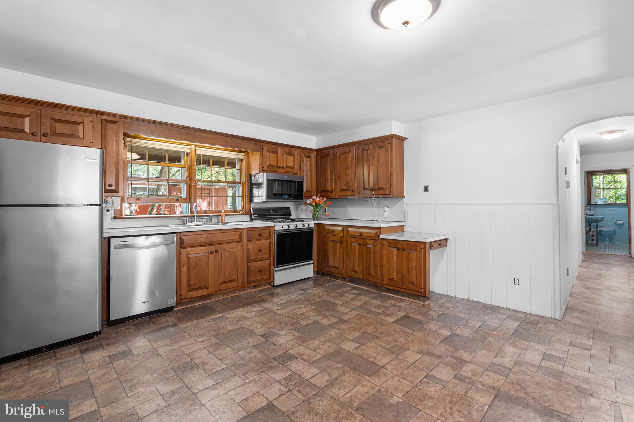 98 Spruce Lane Pine Hill, NJ 08021 - Photo 10 of 28 a kitchen with a sink refrigerator and cabinets
