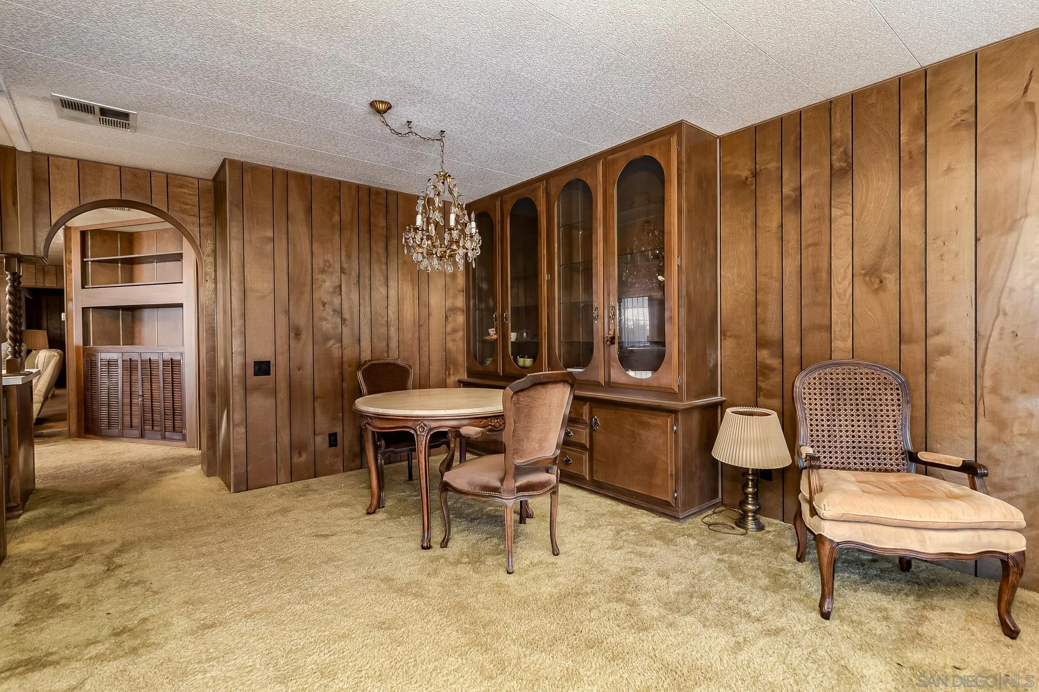 7467 Mission Gorge Road, Unit SPC 291 Santee, CA 92071 - Photo 13 of 40 a bathroom with a toilet a sink and a mirror
