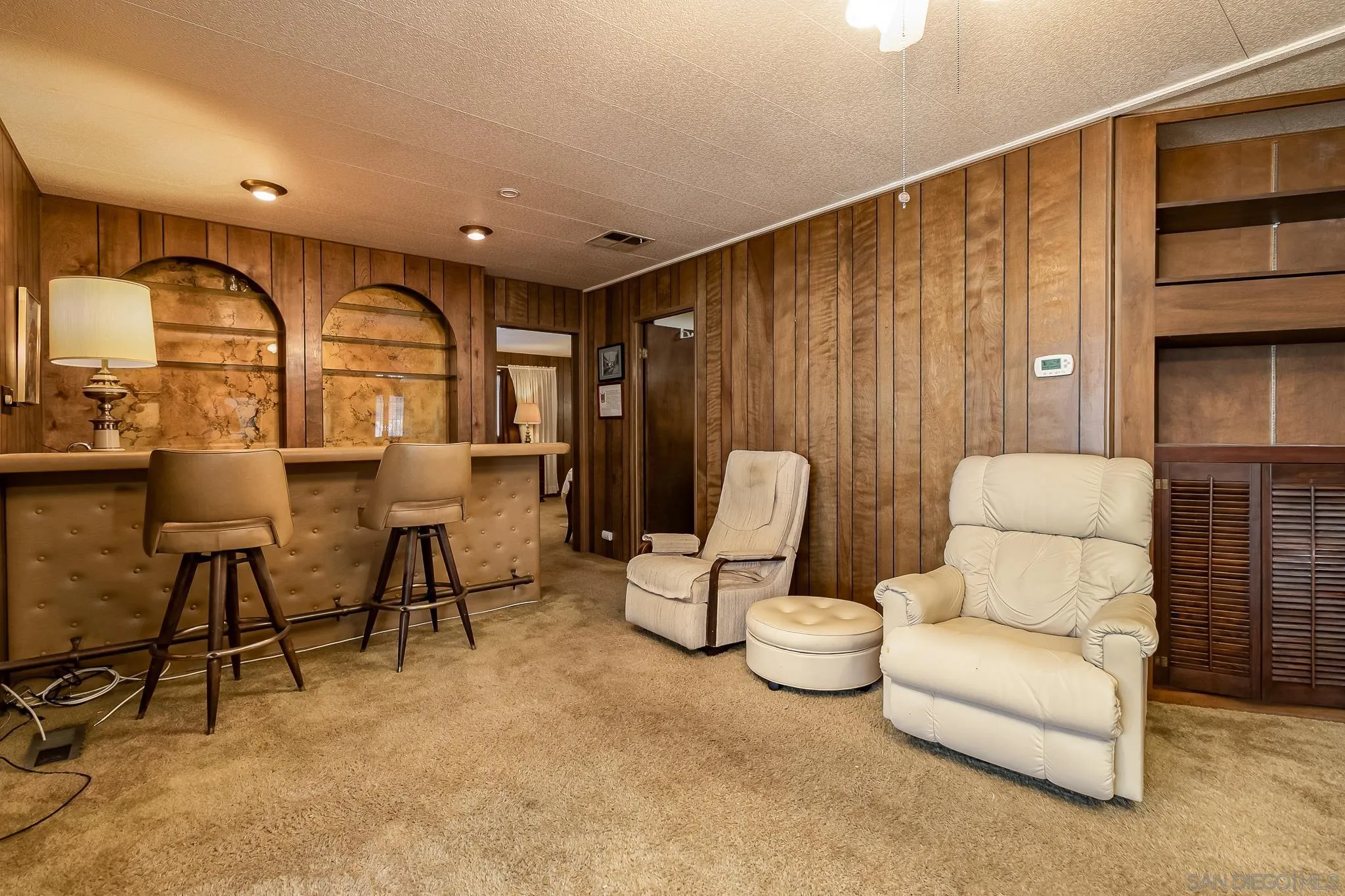 7467 Mission Gorge Road, Unit SPC 291 Santee, CA 92071 - Photo 15 of 40 a living room with furniture a rug and white walls