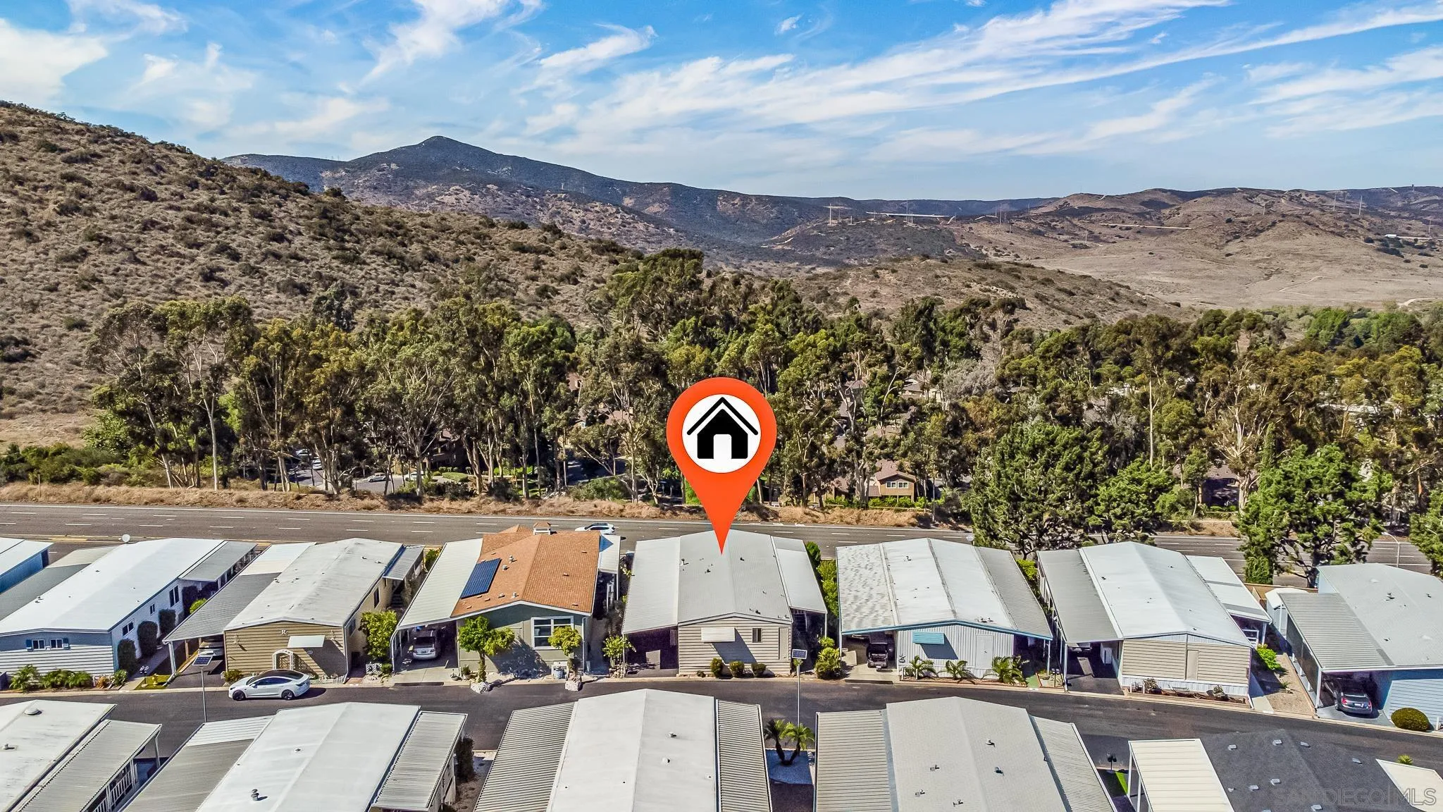 7467 Mission Gorge Road, Unit SPC 291 Santee, CA 92071 - Photo 2 of 40 a view of a street with a building in the background