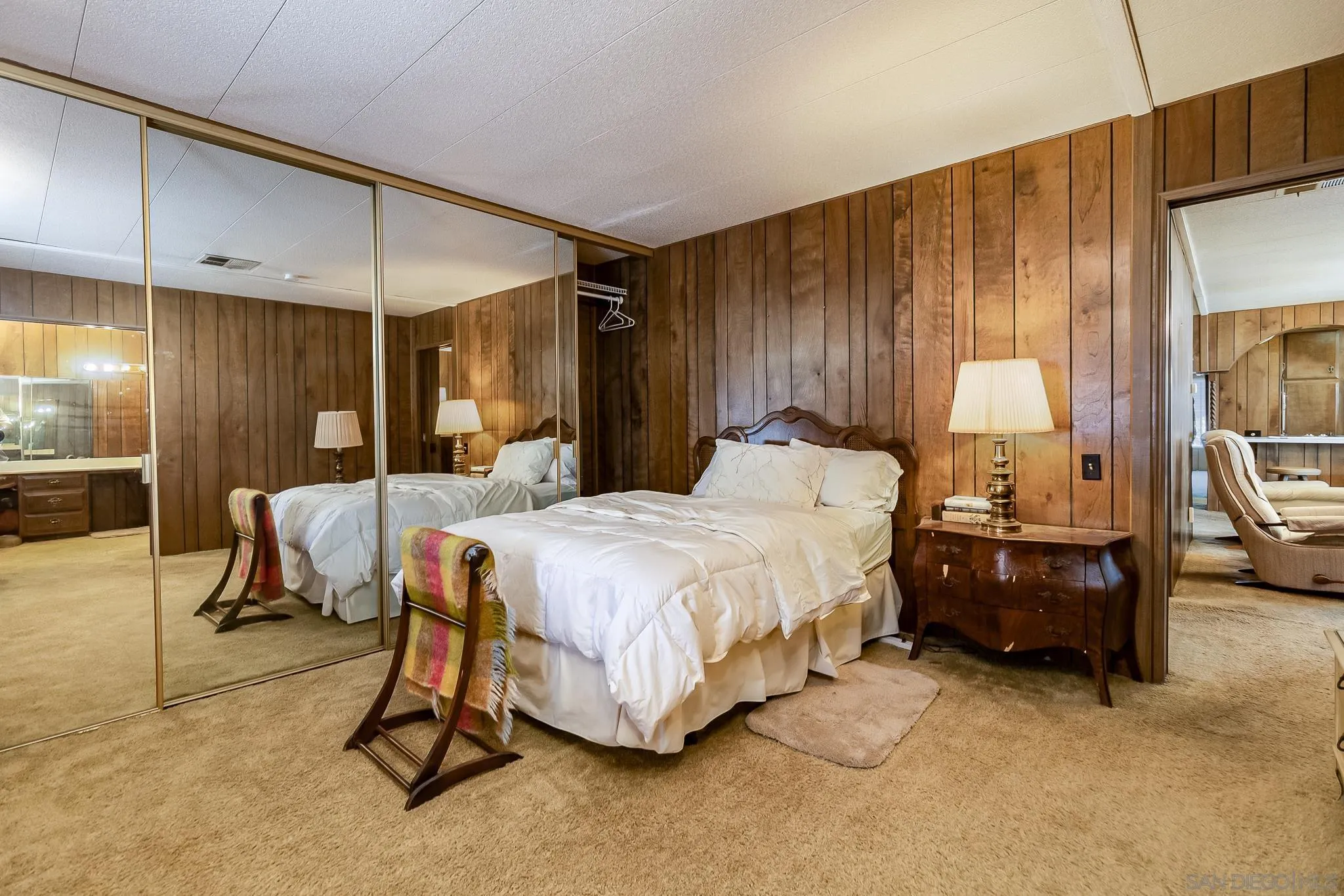 7467 Mission Gorge Road, Unit SPC 291 Santee, CA 92071 - Photo 21 of 40 a bedroom with a bed and a mirror