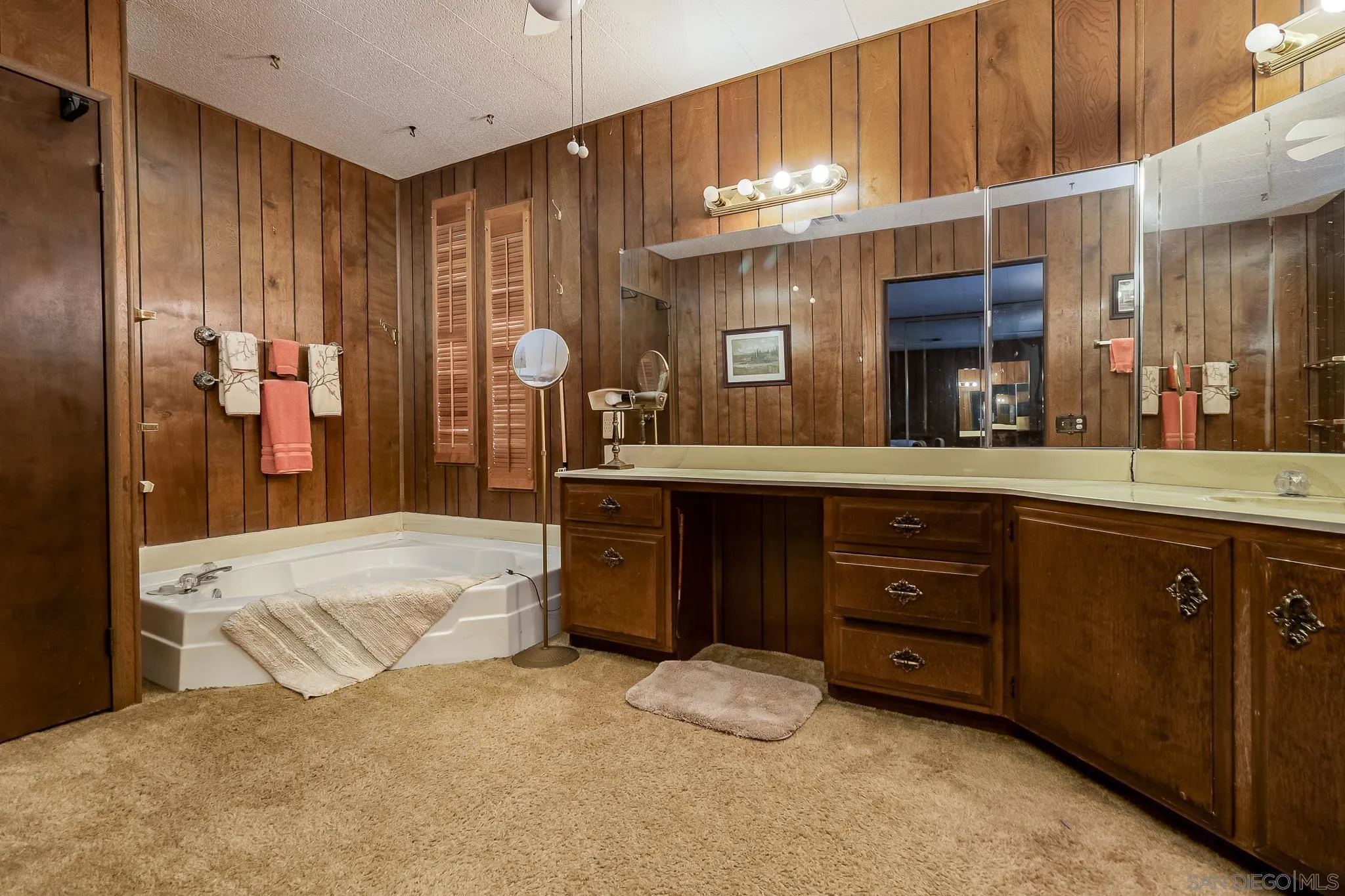 7467 Mission Gorge Road, Unit SPC 291 Santee, CA 92071 - Photo 23 of 40 a large bathroom with a sink and a large mirror