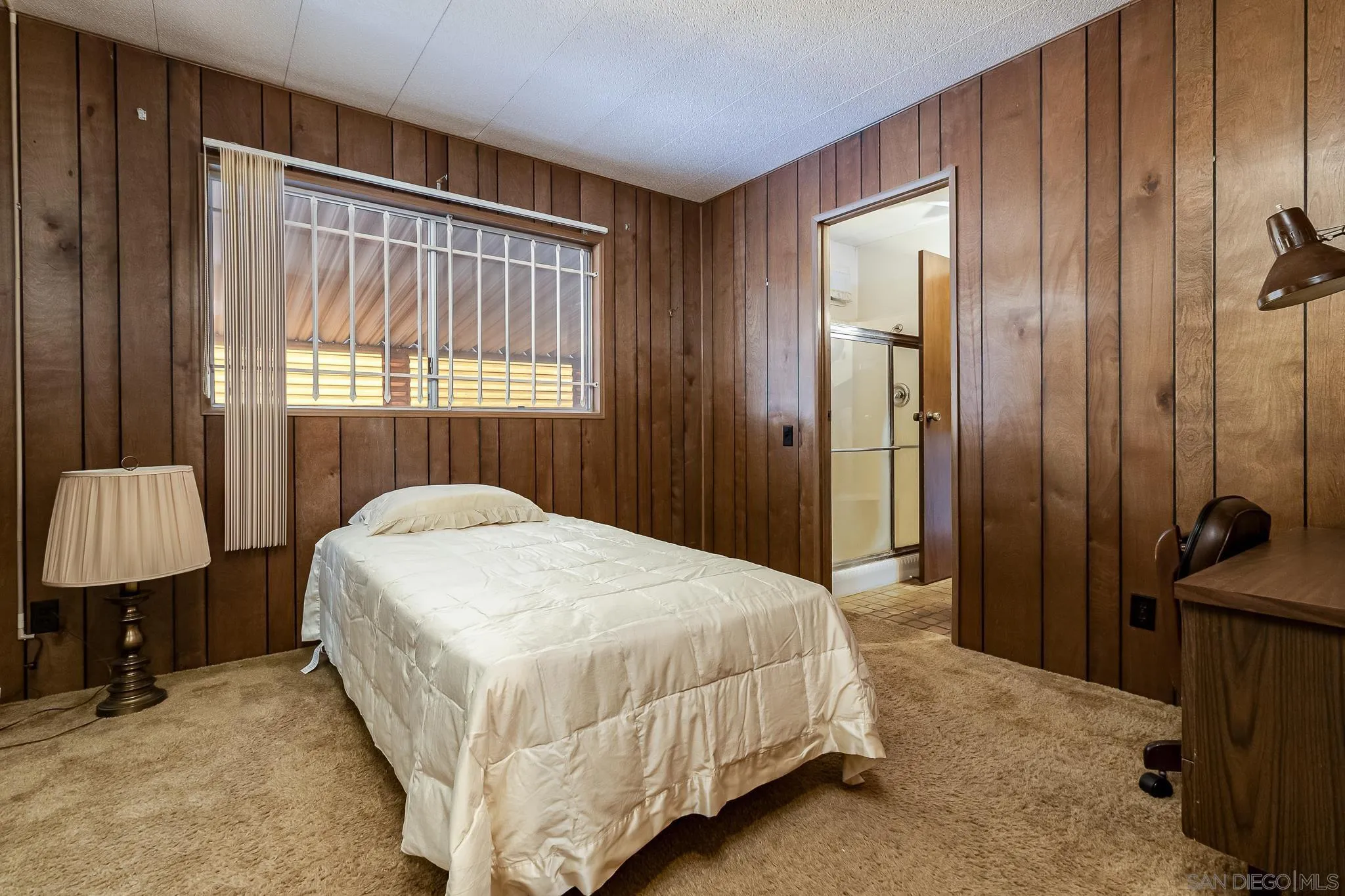 7467 Mission Gorge Road, Unit SPC 291 Santee, CA 92071 - Photo 24 of 40 a bedroom with a bed and a window