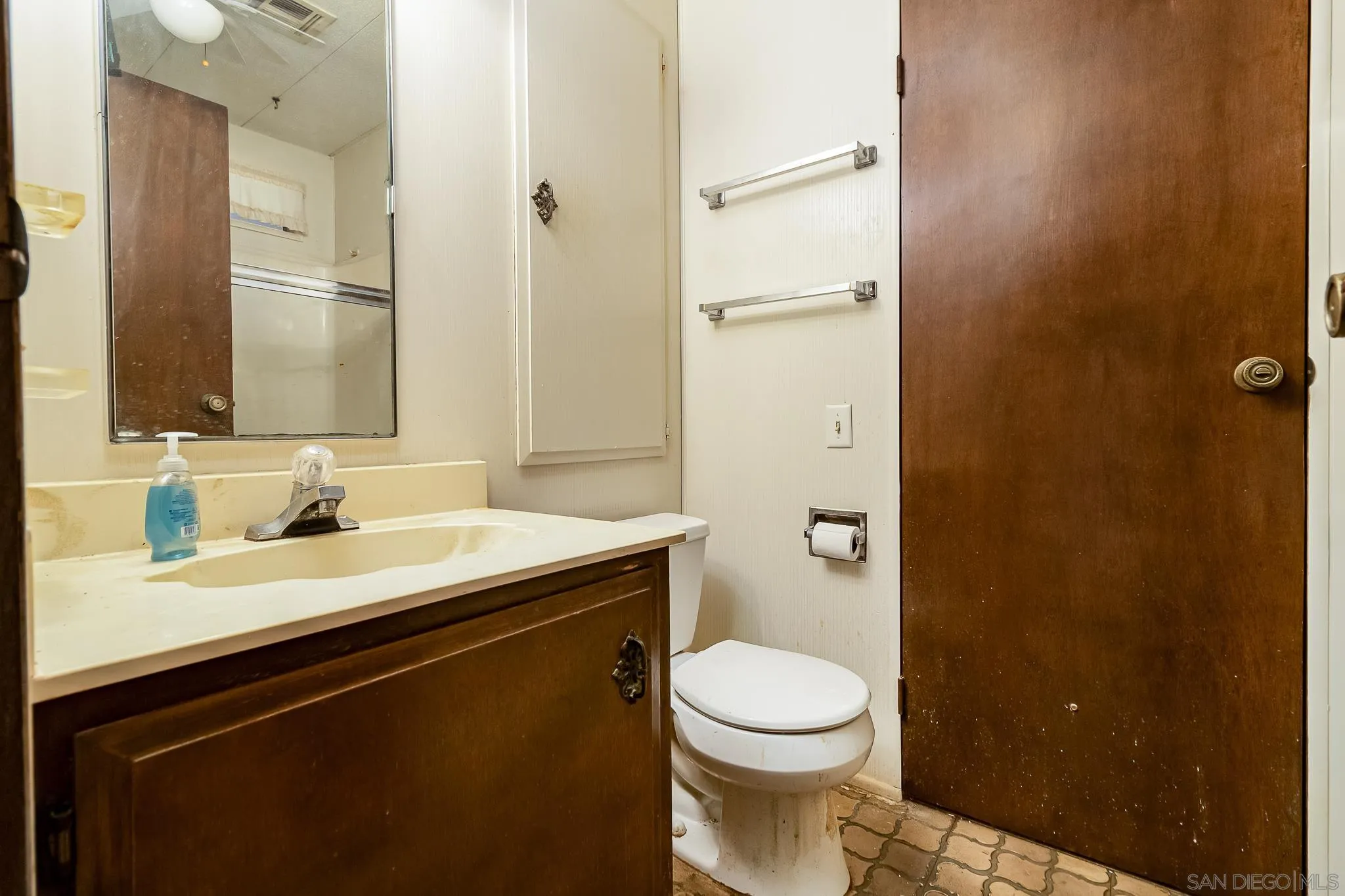 7467 Mission Gorge Road, Unit SPC 291 Santee, CA 92071 - Photo 25 of 40 a bathroom with a granite countertop sink toilet and shower
