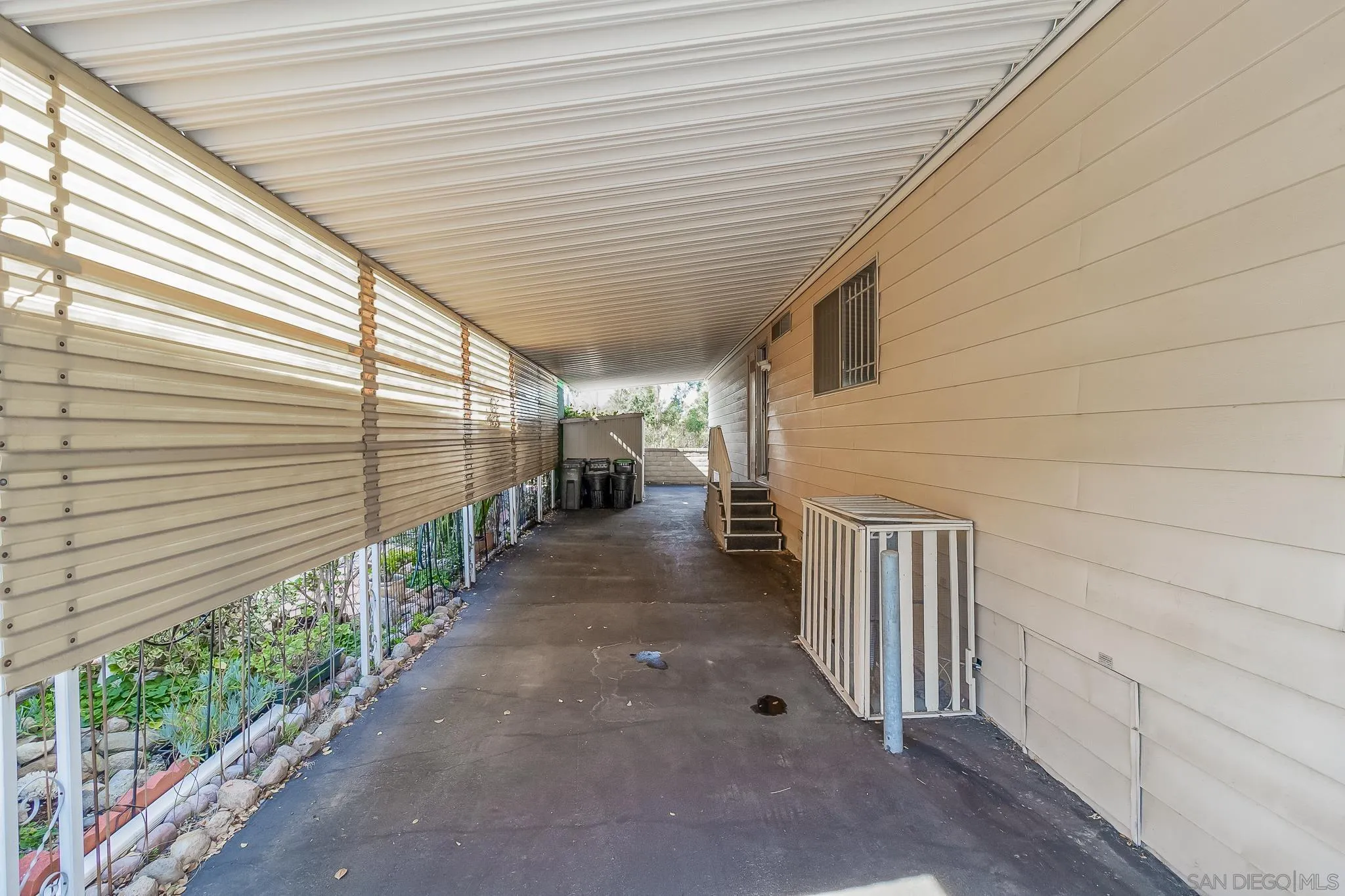 7467 Mission Gorge Road, Unit SPC 291 Santee, CA 92071 - Photo 27 of 40 a view of a porch with a patio