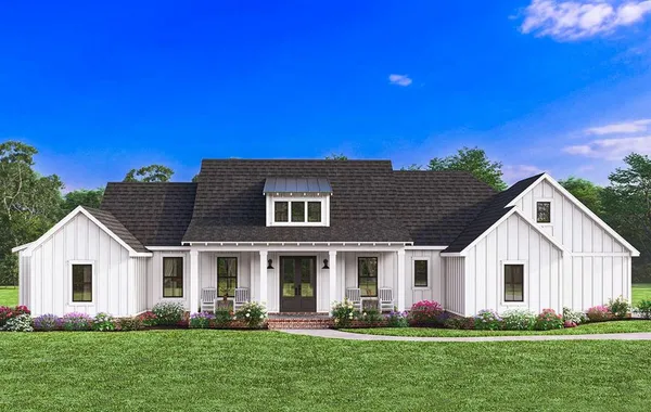 a front view of house with yard and green space