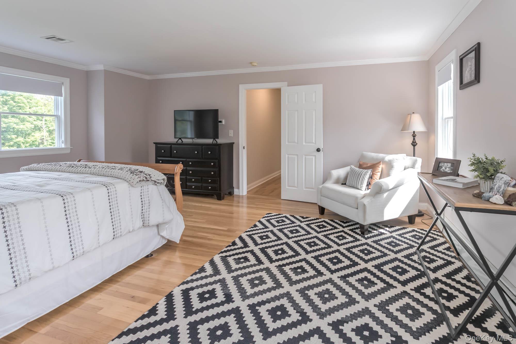 102 Beverly Road Chester, NY 10918 - Photo 26 of 49 a spacious bedroom with a bed and a couch
