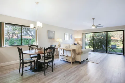 a view of a chairs and table in the garden